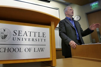 caption: In this Tuesday, March 27, 2007 file photo, former U.S. Attorney John McKay teaches a class at the School of Law at Seattle University in Seattle. 