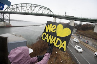 caption: Elbows Up for Canada protesters gather near The Peace Bridge border crossing in Buffalo, N.Y., Wednesday, April 2, 2025.