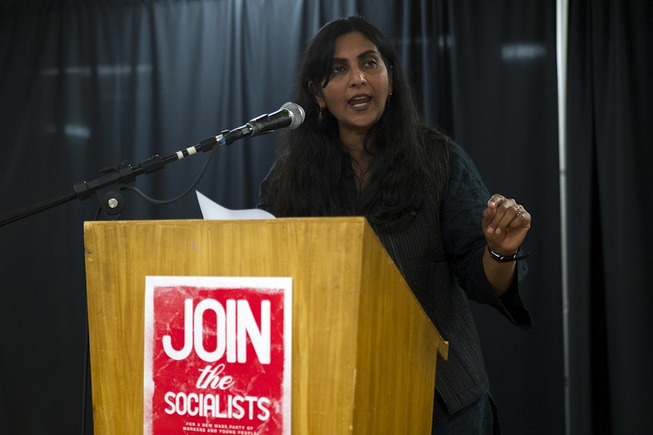 caption: Councilmember Kshama Sawant addresses supporters after early election results showed her trailing behind her District 3 opponent Egan Orion on Tuesday, November 5, 2019, during an election night party at Langston Hughes Performing Arts Institute in Seattle.