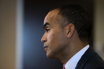 caption: Washington Attorney General Nick Brown addresses members of the press after filing a lawsuit against President Donald Trump’s executive order on birthright citizenship, on Tuesday, January 21, 2025, at the Attorney General’s Office in Seattle. 