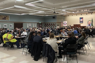 caption: Transit riders, operators, law enforcement officers and public officials gather inside a meeting hall at the IAM union hall in Seattle on March 21, 2025, for the first meeting of the Transit Safety and Security Task Force.
