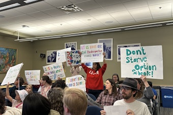 caption: About a dozen parents and educators spoke out against the district's enrollment and waitlist practices at the Seattle School Board meeting April 24, 2025.