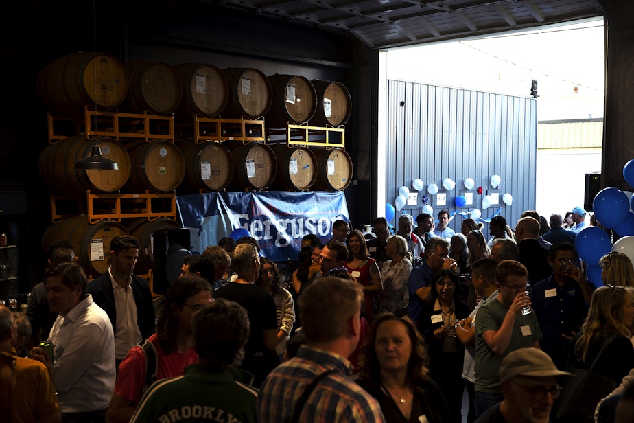 caption: Supporters gather for a primary election night party for Bob Ferguson, the Democrat gubernatorial candidate for Washington state, on Tuesday, August 6, 2024, at Reuben’s Barrel House event space in Seattle.