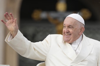 caption: Pope Francis waves to the  faithful at the end of his weekly general audience in St. Peter's Square at the Vatican on Wednesday, Nov. 22, 2023. The pope, who will turn 87 next month, canceled his trip to Dubai for the U.N. climate conference on doctors' orders.