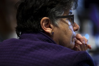 caption: University of Washington President Ana Mari Cauce listens to students during the public comment period of a UW Board of Regents meeting on Thursday, May 9, 2024, on campus in Seattle.  