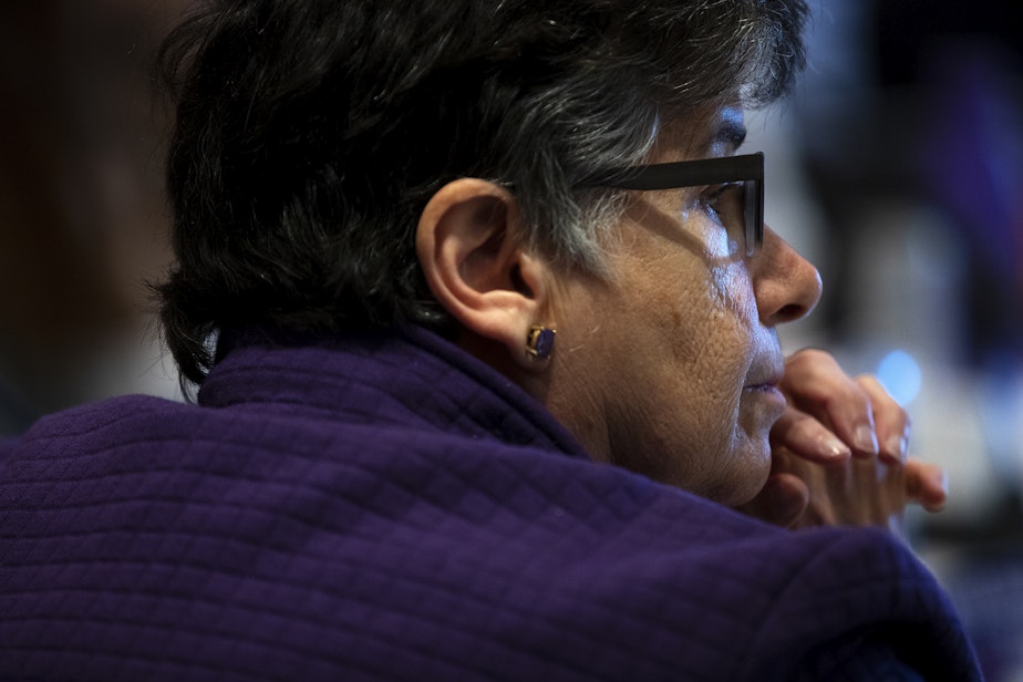 caption: University of Washington President Ana Mari Cauce listens to students during the public comment period of a UW Board of Regents meeting on Thursday, May 9, 2024, on campus in Seattle.
