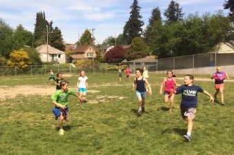 caption: Fourth-graders at Schmitz Park Elementary in West Seattle play capture the flag in their outdoor P.E. class.