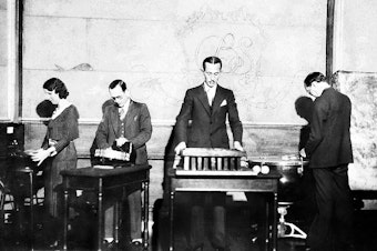 caption: Ora Nichols, left, works on the sound effects for "The March of Time" news reenactment.