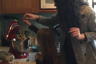 caption: Katherine baking chocolate cookies with Marlo's daughter.