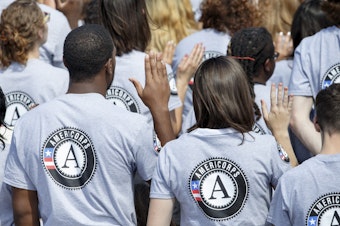 caption: s President Barack Obama and former President Bill Clinton mark the 20th anniversary of the AmeriCorps national service program, hundreds of new volunteers are sworn in for duty at a ceremony, Friday, Sept. 12, 2014, on the South Lawn of the White House in Washington.