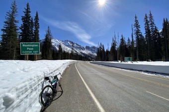 caption: A bike parked on the side of the North Cascades Highway near Washington Pass in 2024.