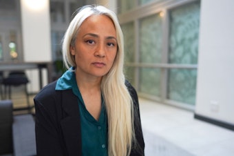 caption: Ngoc Phan spoke with press Monday, May 26th, 2025, about her husband's deportation to South Sudan at the offices of the Northwest Immigrant Rights Project in Seattle. She grew up in Tacoma. 