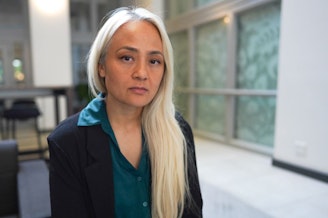 caption: Ngoc Phan spoke with press Monday, May 26th, 2025, about her husband's deportation to South Sudan at the offices of the Northwest Immigrant Rights Project in Seattle. She grew up in Tacoma. 