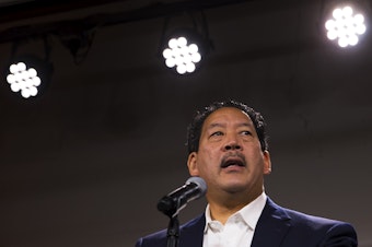 caption: Bruce Harrell speaks to a crowd of supporters during an election night party on Tuesday, November 2, 2021, at Block 41 on Bell Street in Seattle.