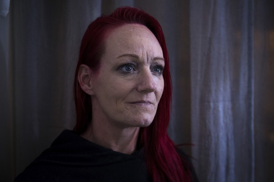 caption: Robin Curtis in her room at a downtown Seattle shelter on Friday, November 15, 2019.