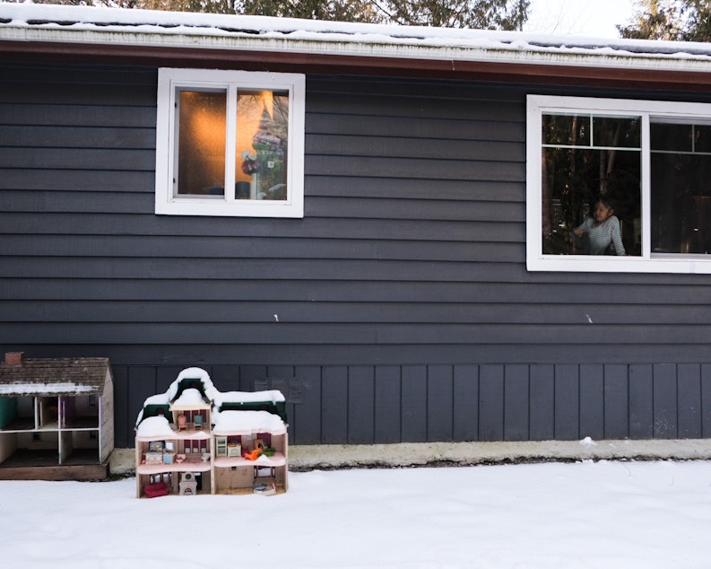caption: Six-year-old Aliyah Chaj-Villatoro looks out the window of her home in Maple Falls, Washington. She and her siblings left the U.S. to join her father, who was arrested and deported to Guatemala.