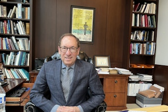 caption: Seattle-based U.S. District Judge Robert Lasnik in his chambers on April 3, 2025. 