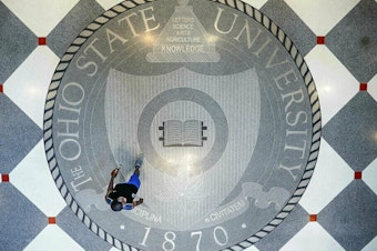 caption: Pedestrians pass through The Ohio State University's student union.