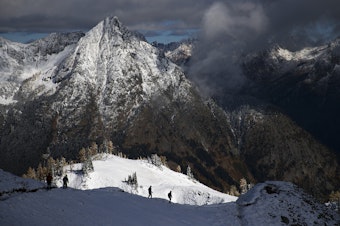 caption: FILE: Hikers walk along Heather-Maple Pass Loop in North Cascades National Park in October 2017. 