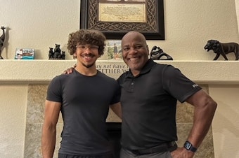 caption: Calvin Lowe and his son, Tyler.