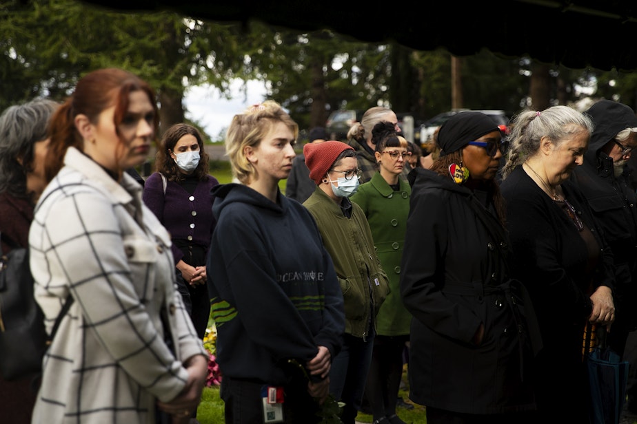 caption: People pay their respects during the 2023 Indigent Remains ceremony hosted by the King County Medical Examiner’s Office on Wednesday, Oct. 25, 2023, at Mt. Olivet Cemetery in Renton.