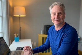 caption: Banker Edward Barry and his team managed to broker nearly 600 small business loans while working from home.