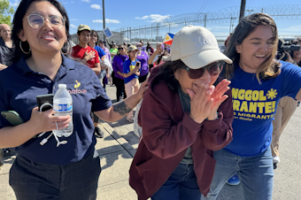 caption: University of Washington employee and Filipina green card holder Lewelyn Dixon (center) was released from the Tacoma ICE center on Thursday, May 29, 2025 after being in detention for several months. 