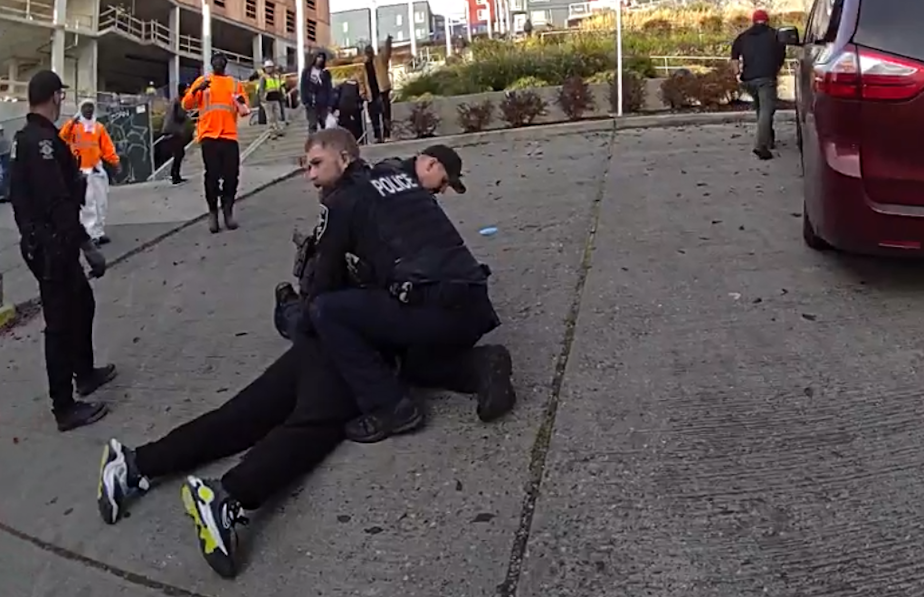 caption: After a pursuit through Little Saigon, Seattle police arrest a suspect who allegedly stabbed five people nearby on Friday, Nov. 8, 2024. The incident on Friday was part of a string of stabbings in less than two days that had the neighborhood on edge.