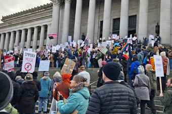 caption: Protesters opposing the Trump administration gather at the Washington state Capitol in Olympia on Wednesday, Feb. 5, 2025.